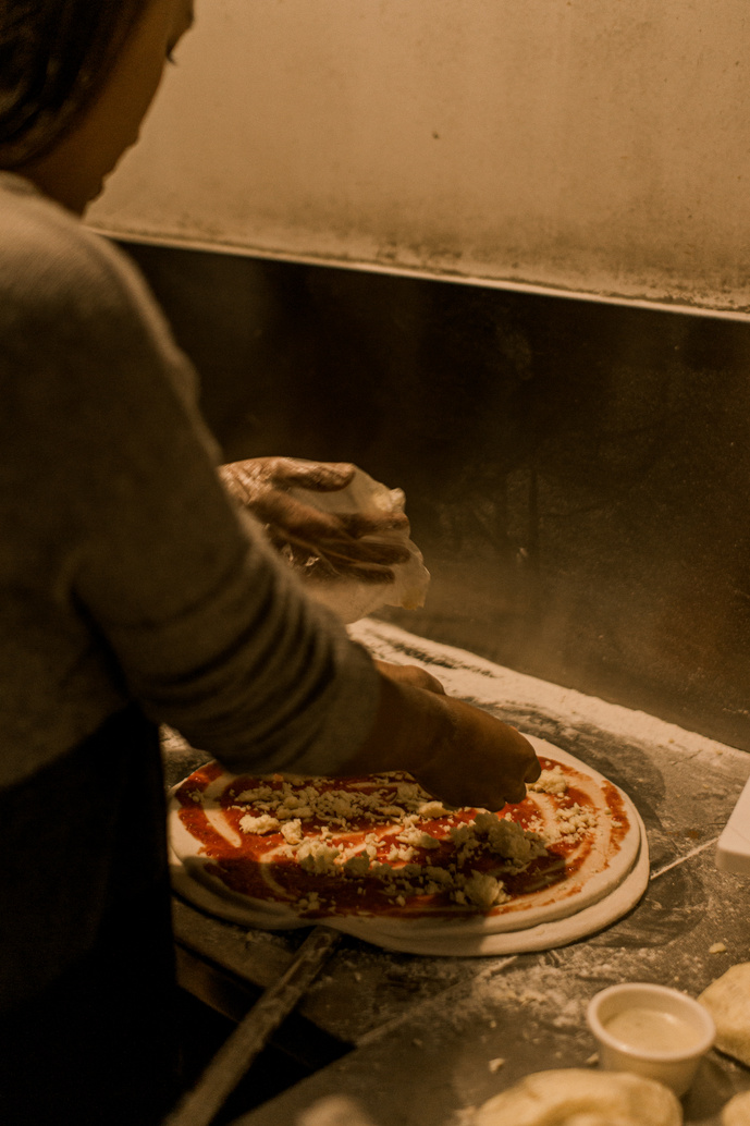 Woman Making Pizza